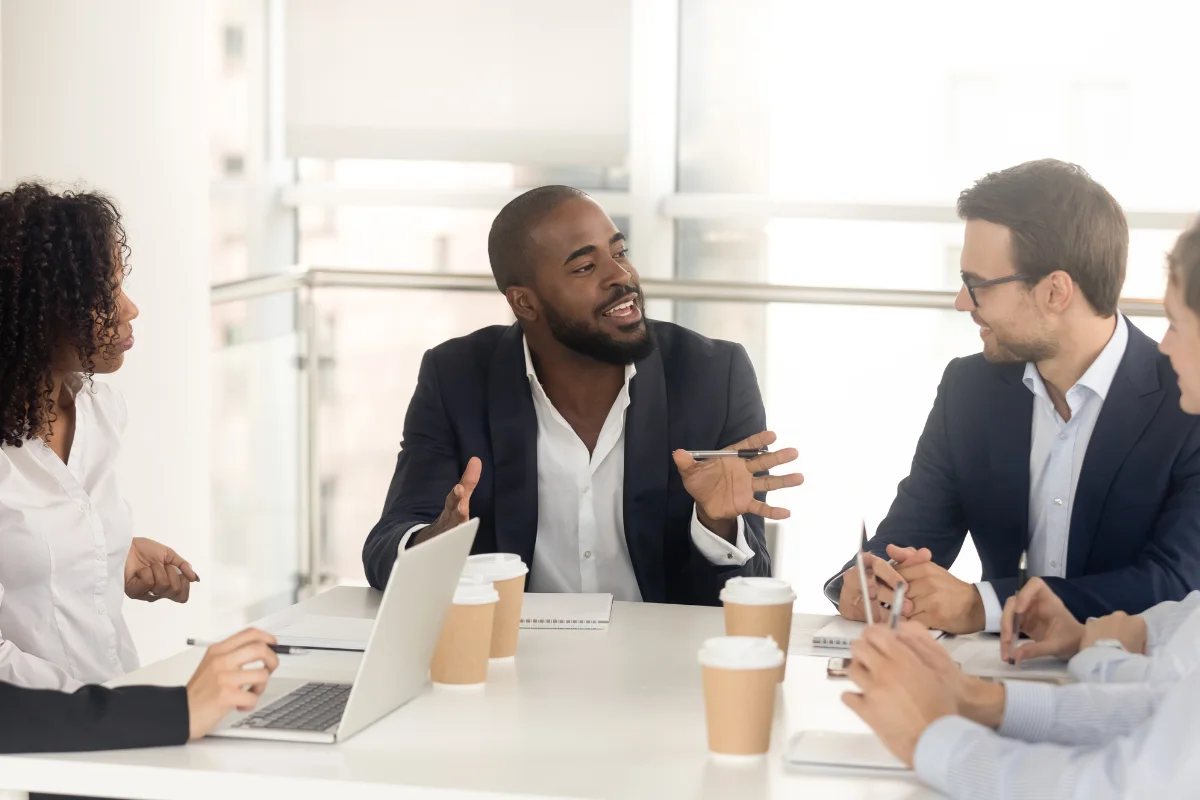 Man leads a discussion in a team meeting