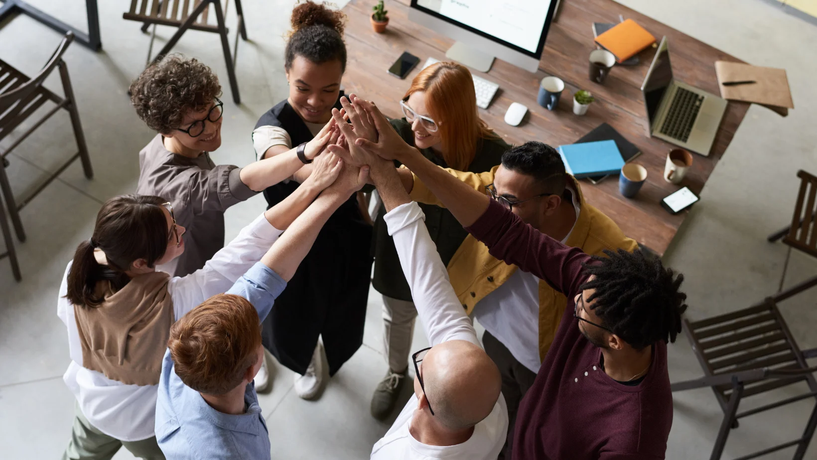Team work in a circle all hands in upward