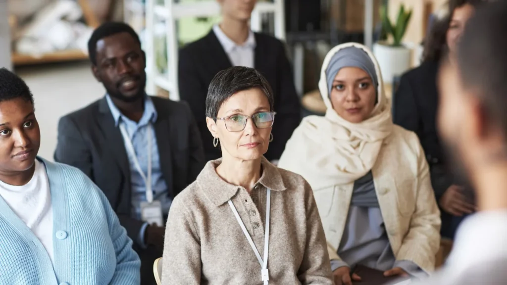 A group of people listening to a talk.